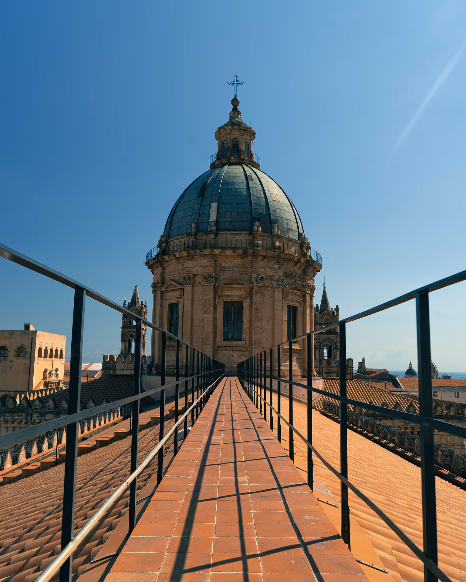 Bright blue sky over the historic rooftop of Cattedrale di Palermo in Sicily