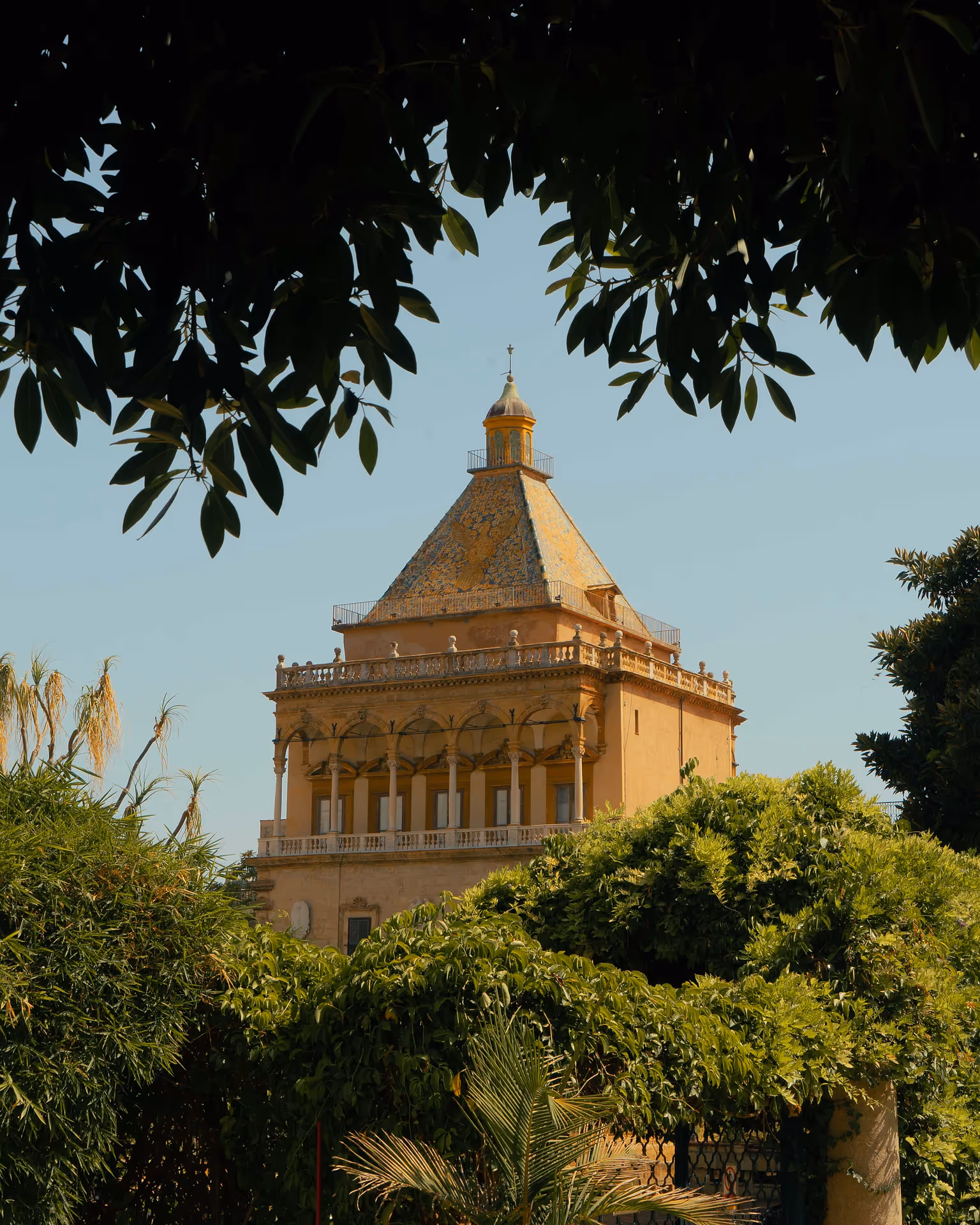 An old building framed by greenery