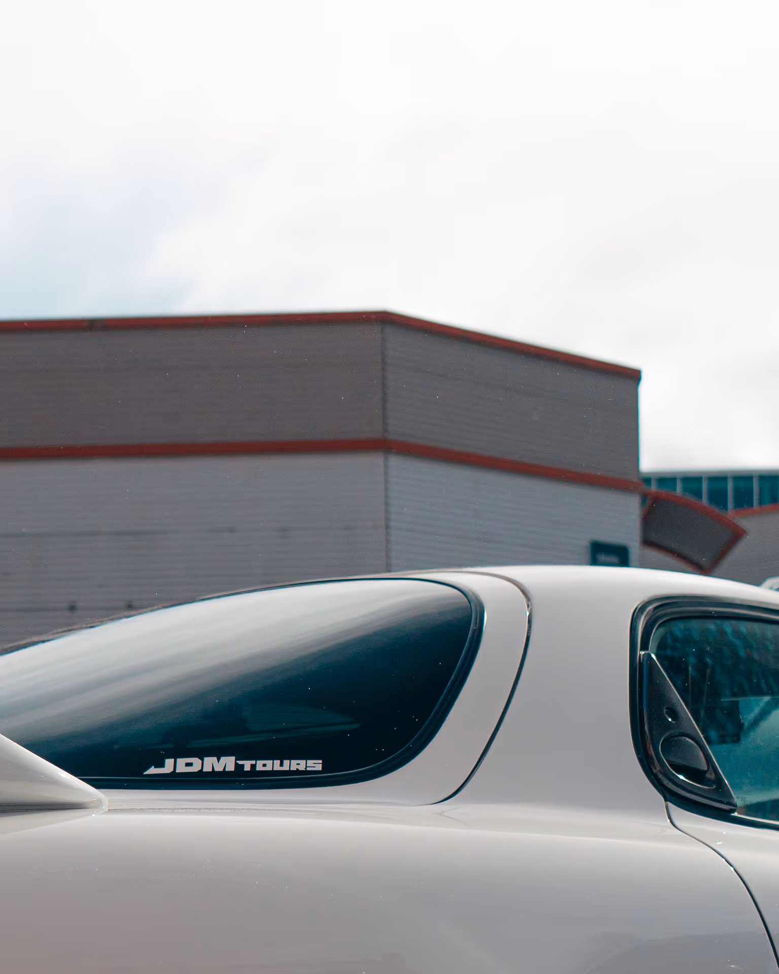A white sticker on the back of a car window