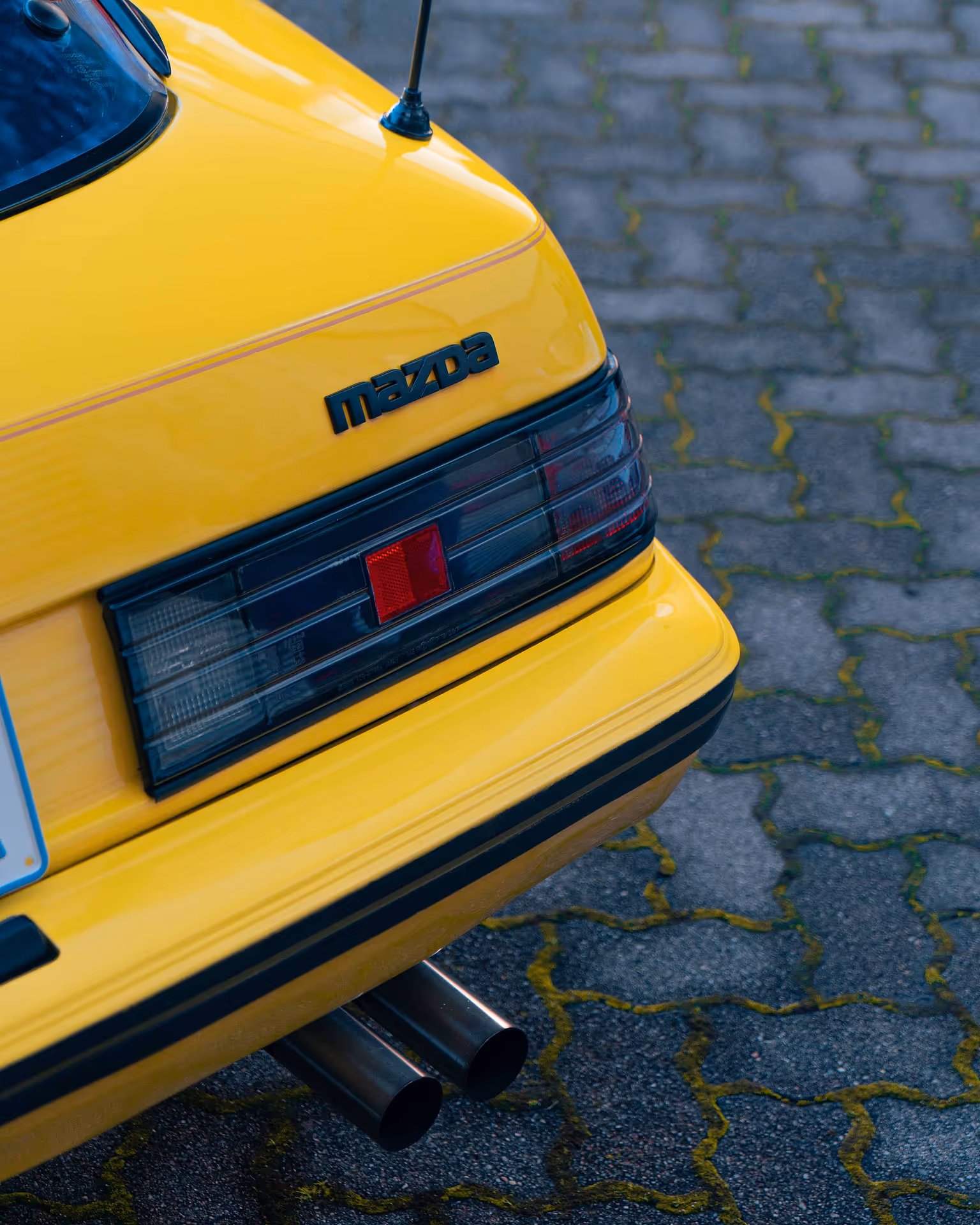 Rear lights of an old yellow car